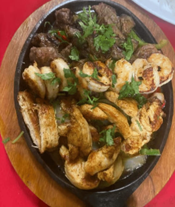 Tex-Mex (Chicken, Steak & Shrimp) Fajitas.